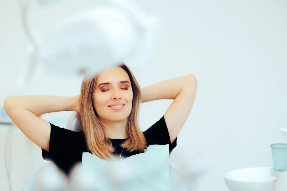 A relaxed patient resting in a dental chair